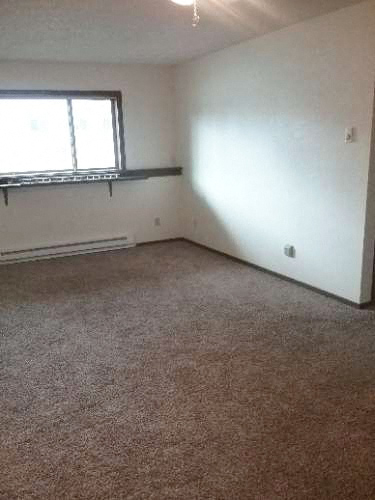 Image of open space with heater and window